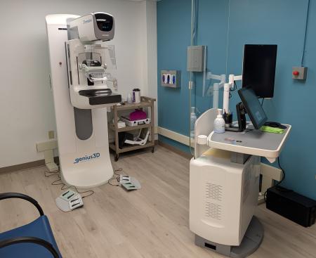 A mammography machine in a medical exam room