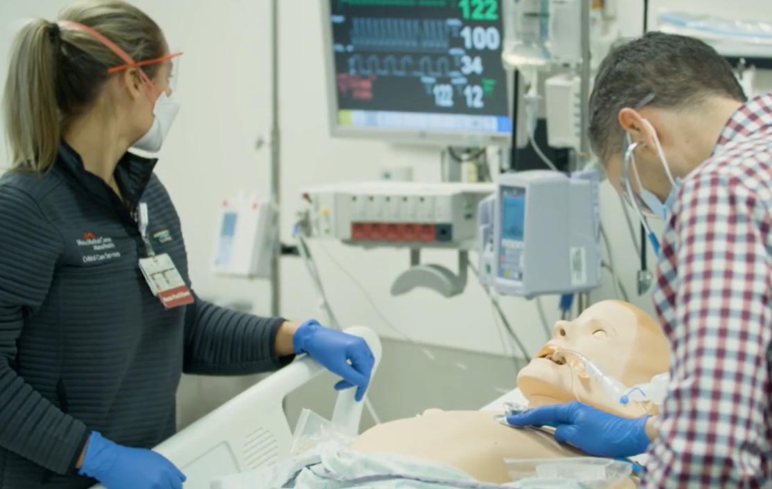 MaineHealth APP Critical Care fellows practice their skills on a medical dummy