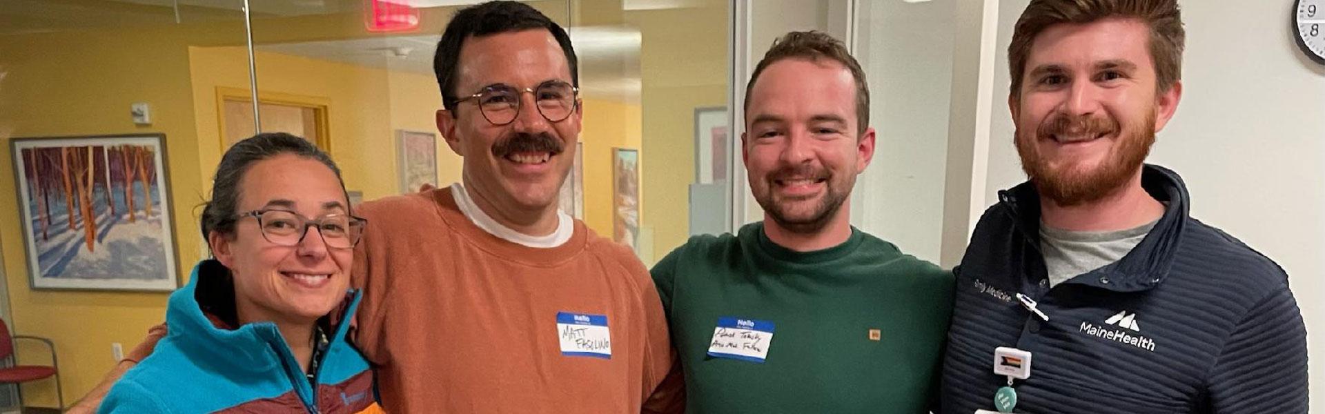 Four mhmmc preventive medicine fellows stand together