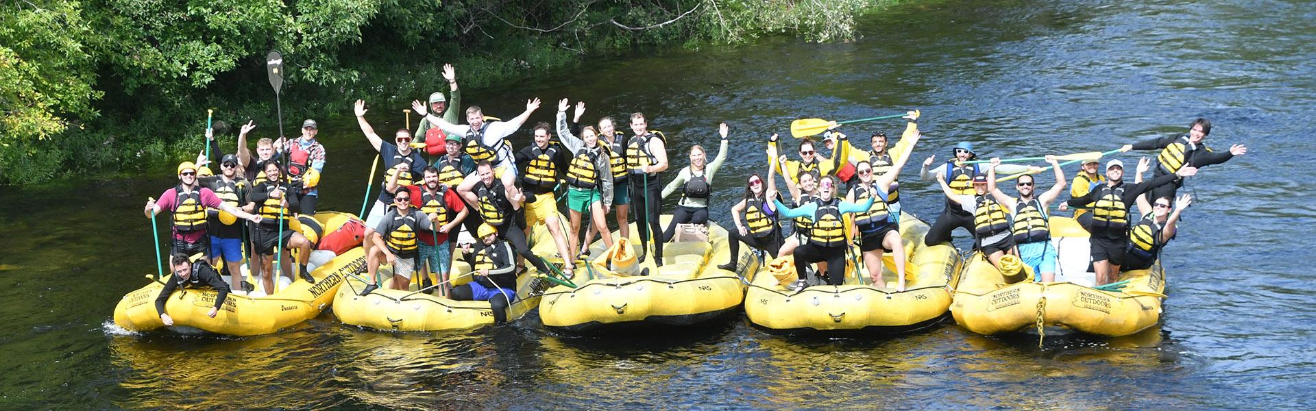 a group of residents rafting on a river