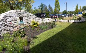 A bright green grassy garden at MaineHealth Waldo Hospital