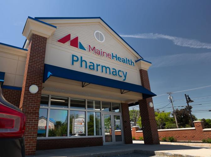 Exterior of 1052 Brighton Ave Portland with large sign that says MaineHealth Pharmacy
