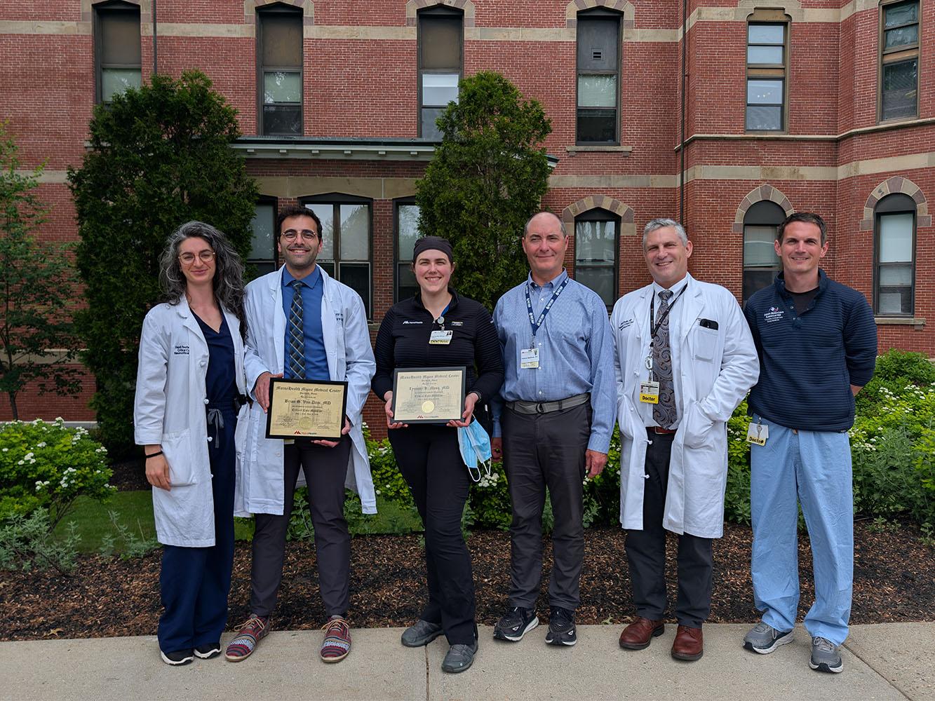 A group of fellows and faculty standing together outside MHMMC