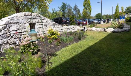 A bright green grassy garden at MaineHealth Waldo Hospital
