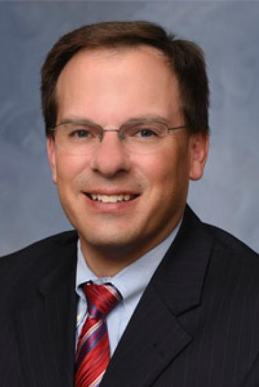 A headshot of Michael Perry